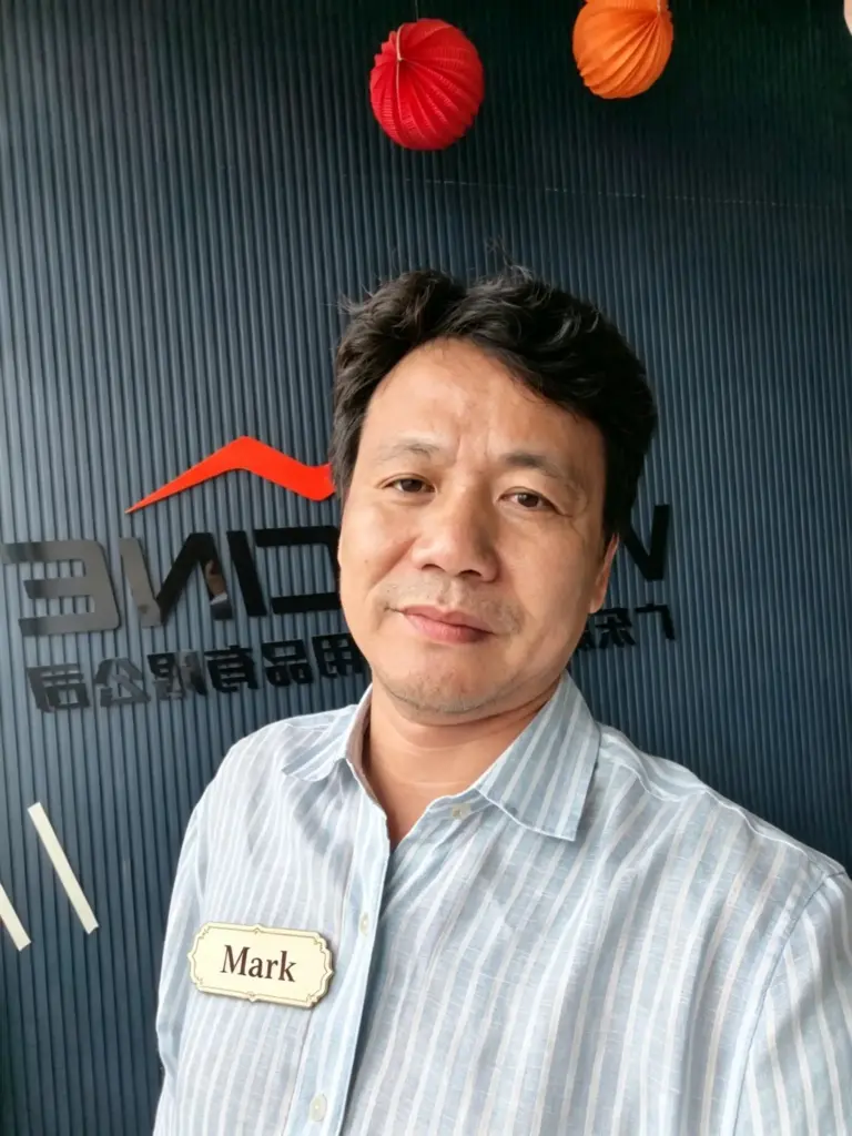 Headshot of Mark, in-house custom cabinet designer for Australian & North American projects, expert on kitchen cabinet, wardrobe and bathroom vanity customized design solutions, factory corporate portrait